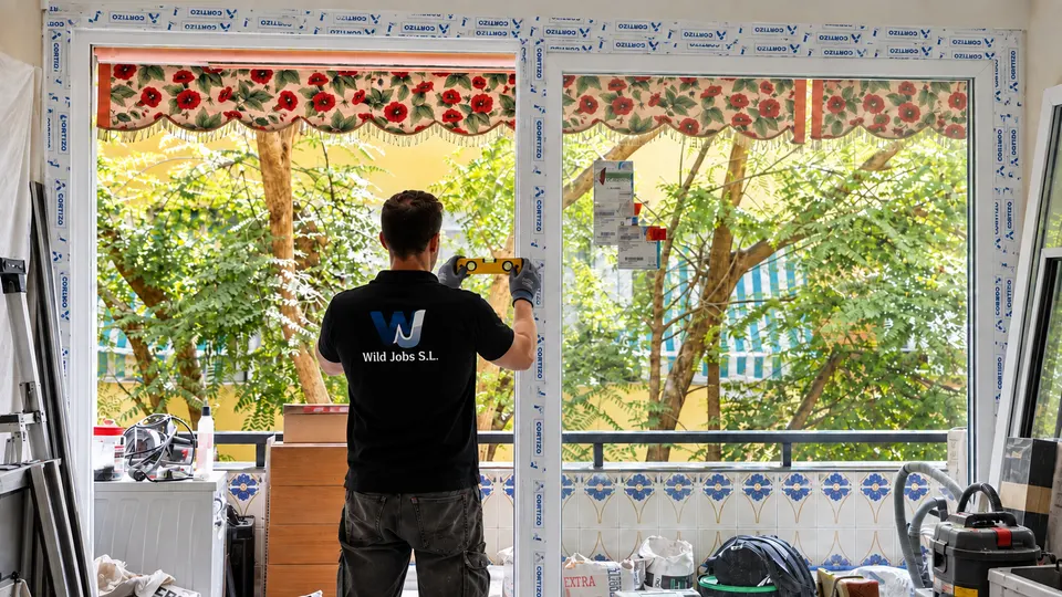 WildJobs technician installing new glazing during a renovation
